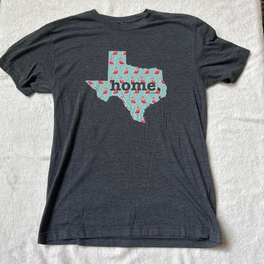 The Home T Gray t-shirt with Texas graphic featuring pink flamingos 'home.'
